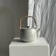 Small Asian stoneware teapot with rattan handle H11 D10
