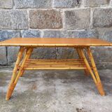 Rattan coffee table with compass legs