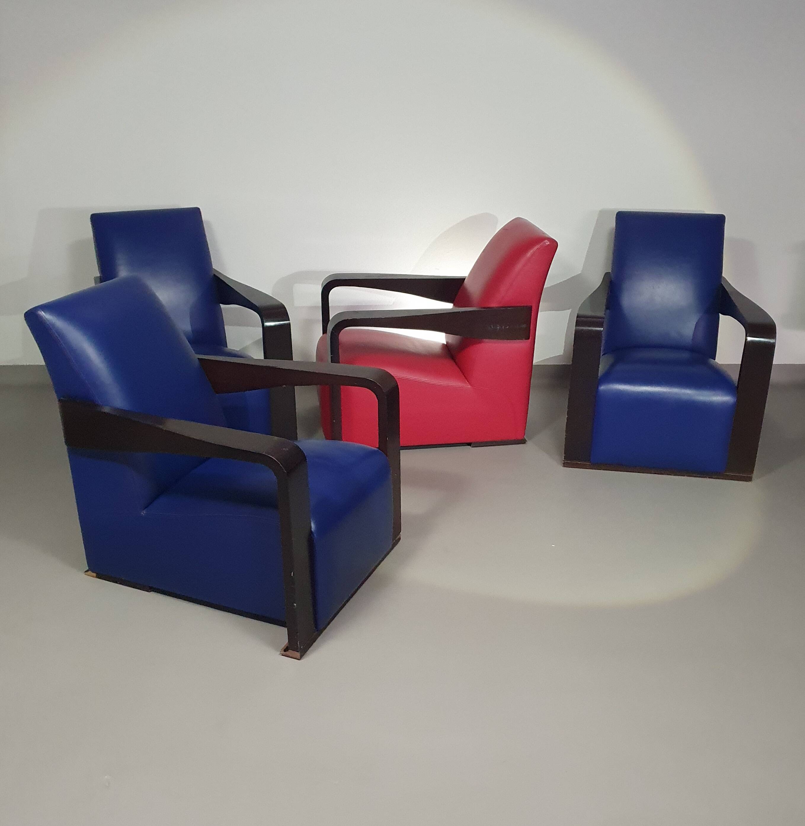 4 x Vintage Ying lounge chairs / fauteuils van Hugues Chevalier,'90. 3 x blue / 1 x red leather