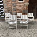 Five wooden garden armchairs