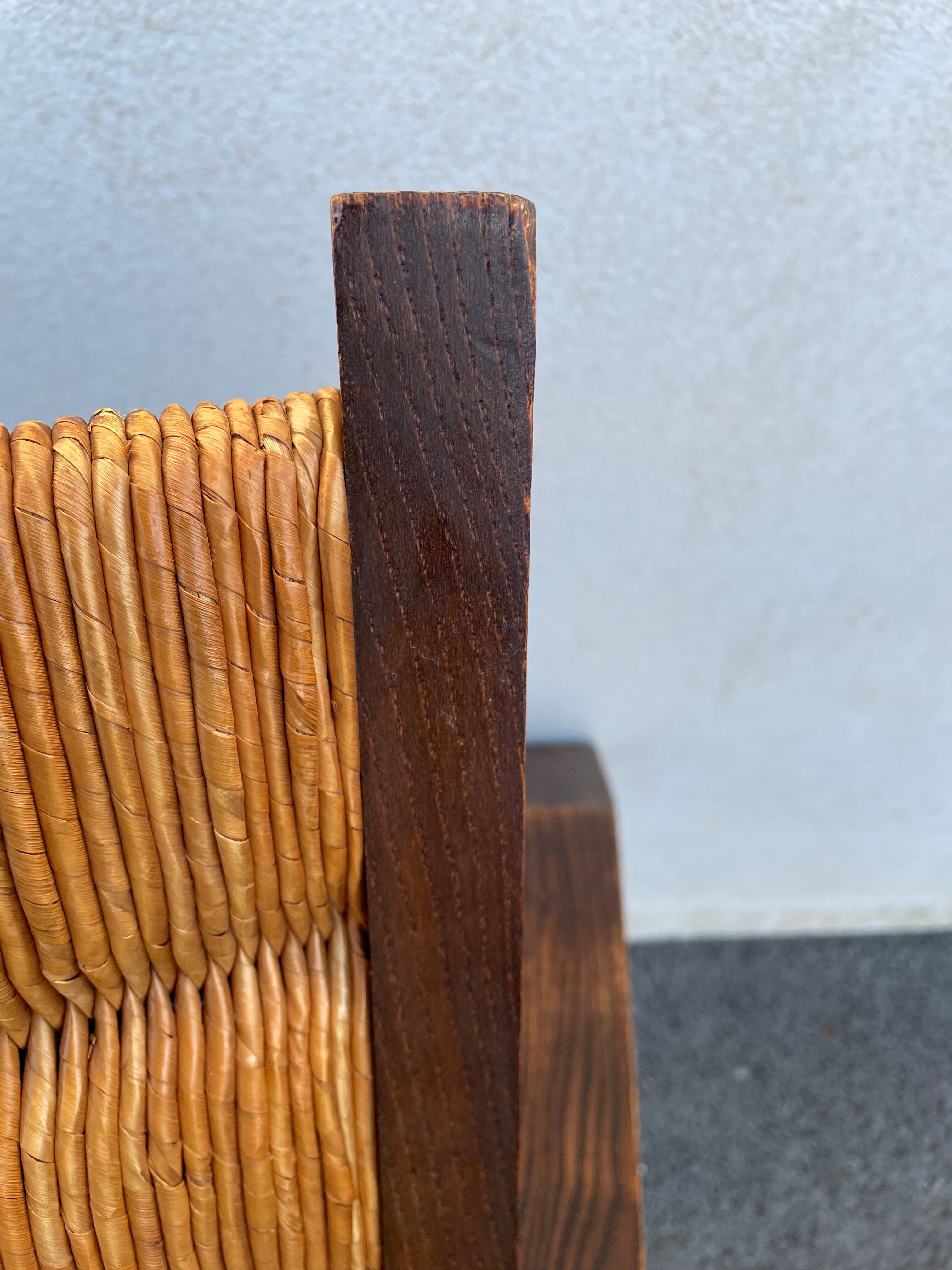 Vintage armchair in straw and brutalist wood