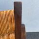 Vintage armchair in straw and brutalist wood