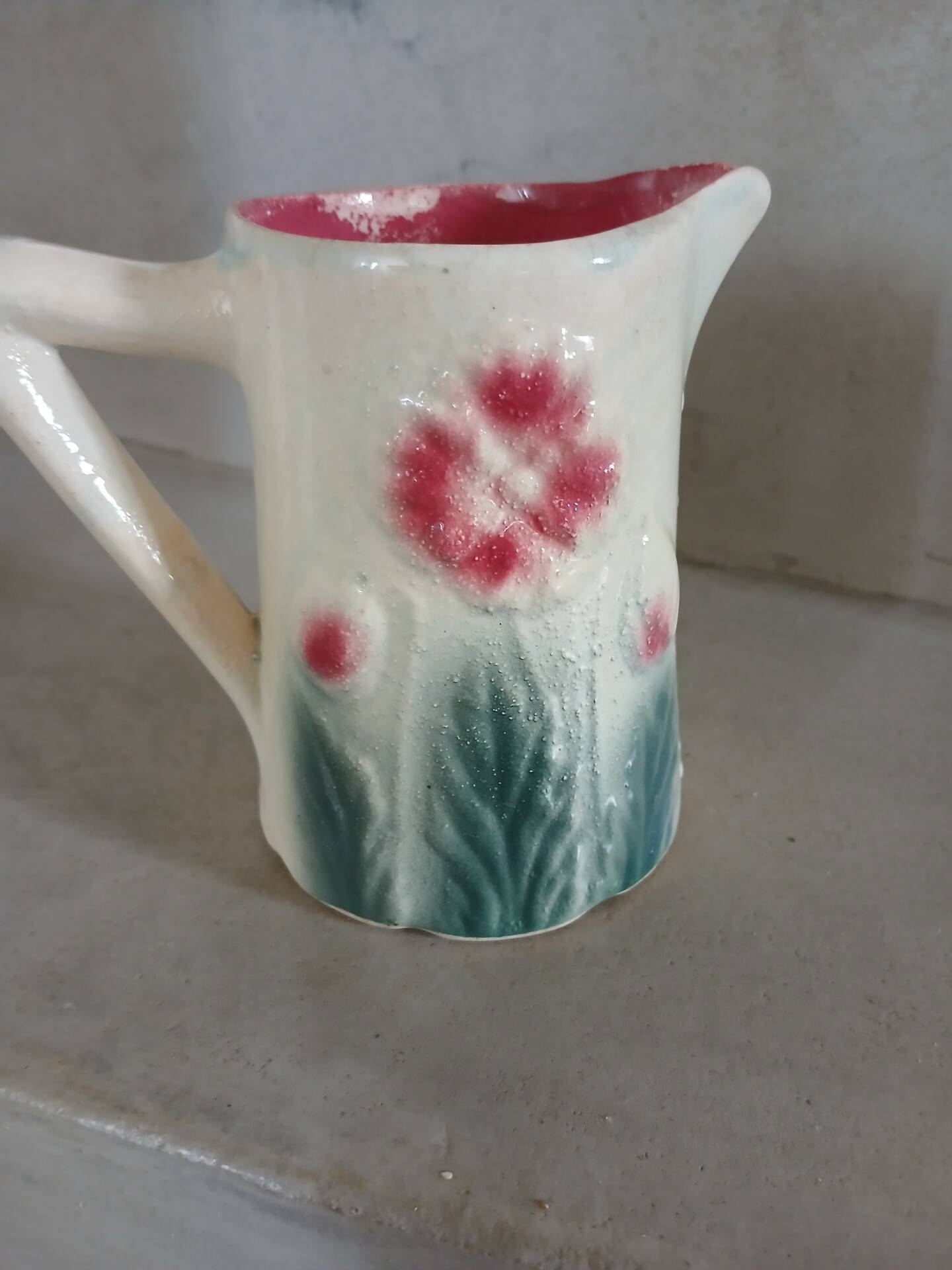 Small antique jug in slipware.