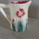 Small antique jug in slipware.
