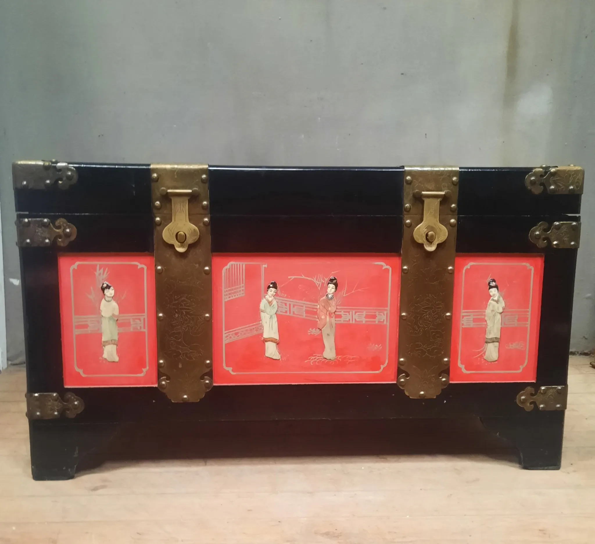 Red lacquered wooden mallet from the Far East.