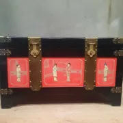 Red lacquered wooden mallet from the Far East.