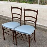 2 Napoleon III chairs in solid wood and blue satin fabric.