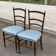 2 Napoleon III chairs in solid wood and blue satin fabric.