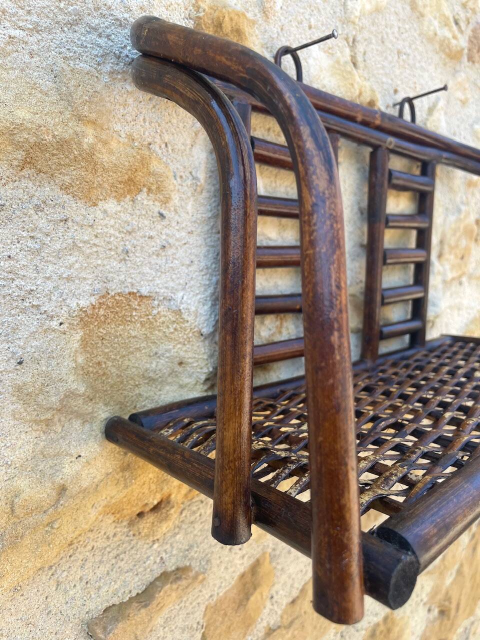 Vintage wall shelf in bamboo and rattan, circa 1960s.