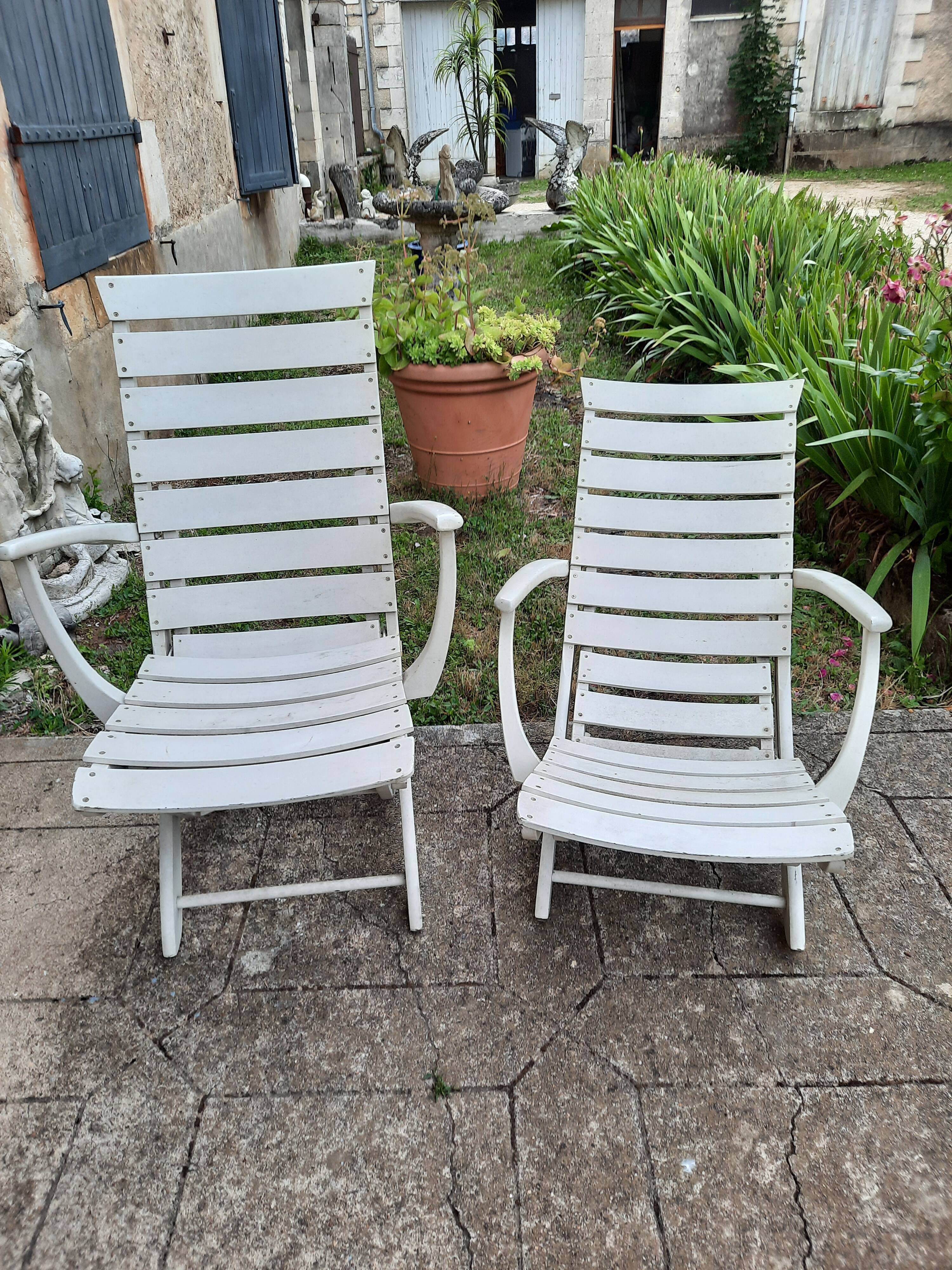 Pair of wooden garden armchairs