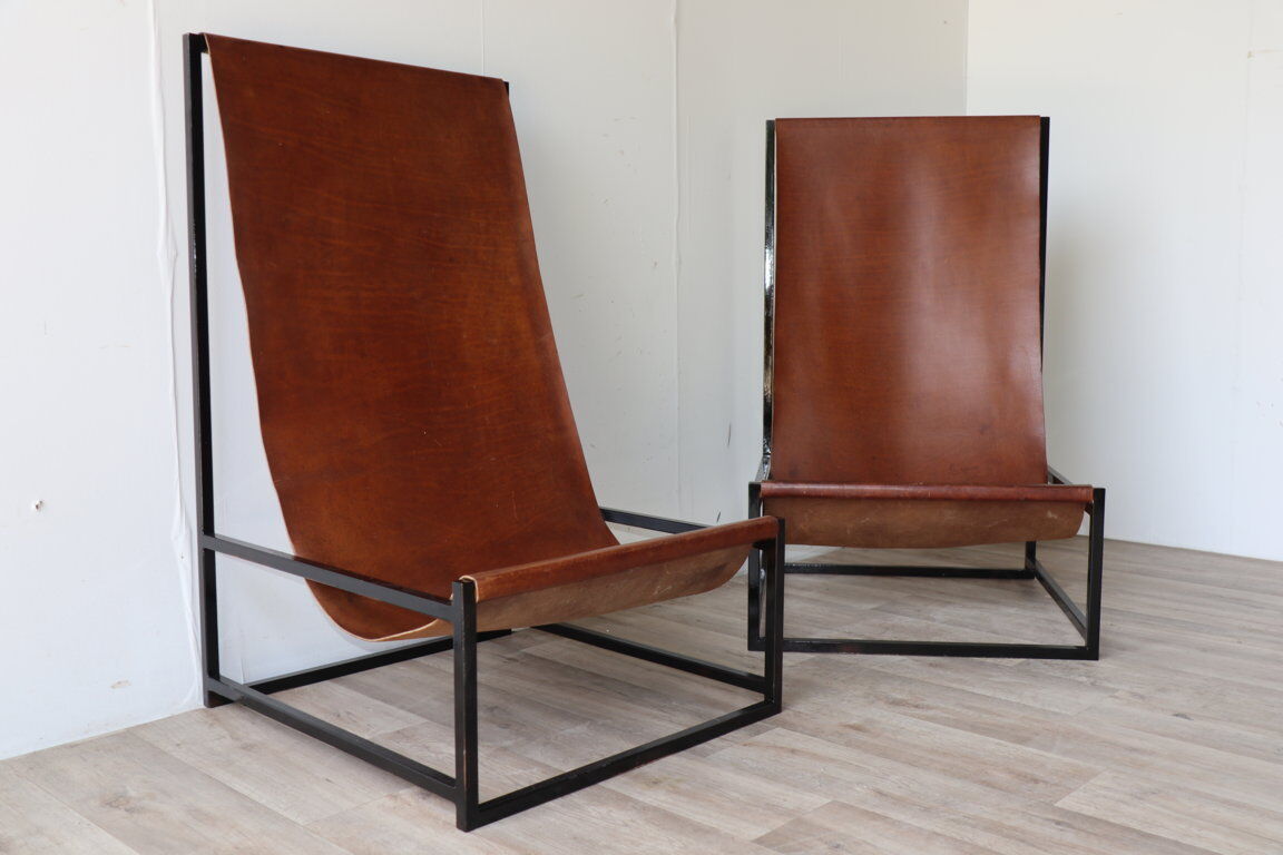 Pair of vintage armchairs in stretched leather and metal structure