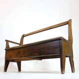 Handcrafted wooden bench with armrest and drawer on the right.