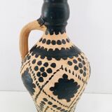 Raw and black terracotta jug