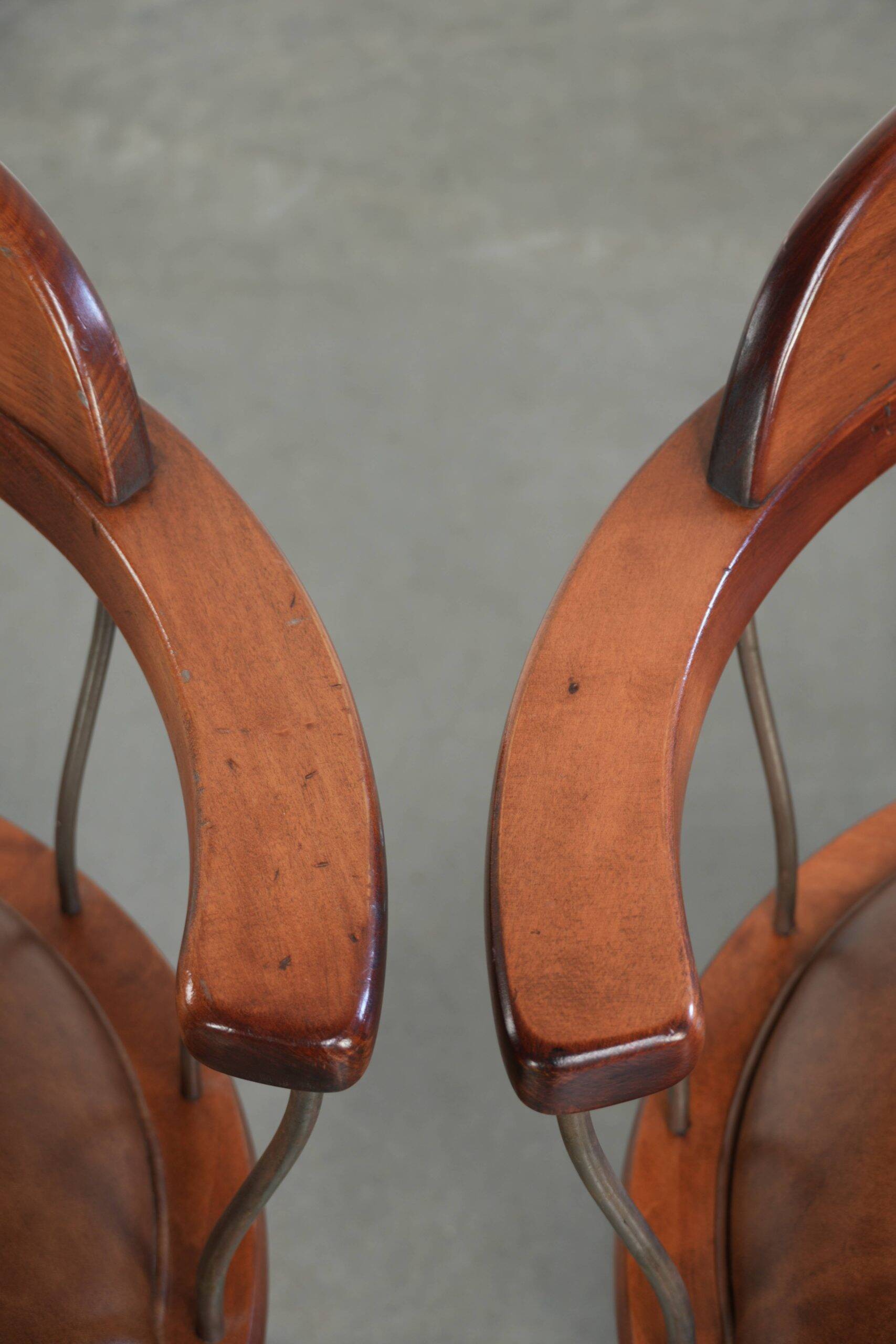 Set of 2 swivel/office chairs with a cognac-coloured cow leather seat