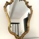 Old golden mirror in composite resin baroque style 60s