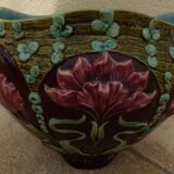 Old earthenware cachepot with flower decoration