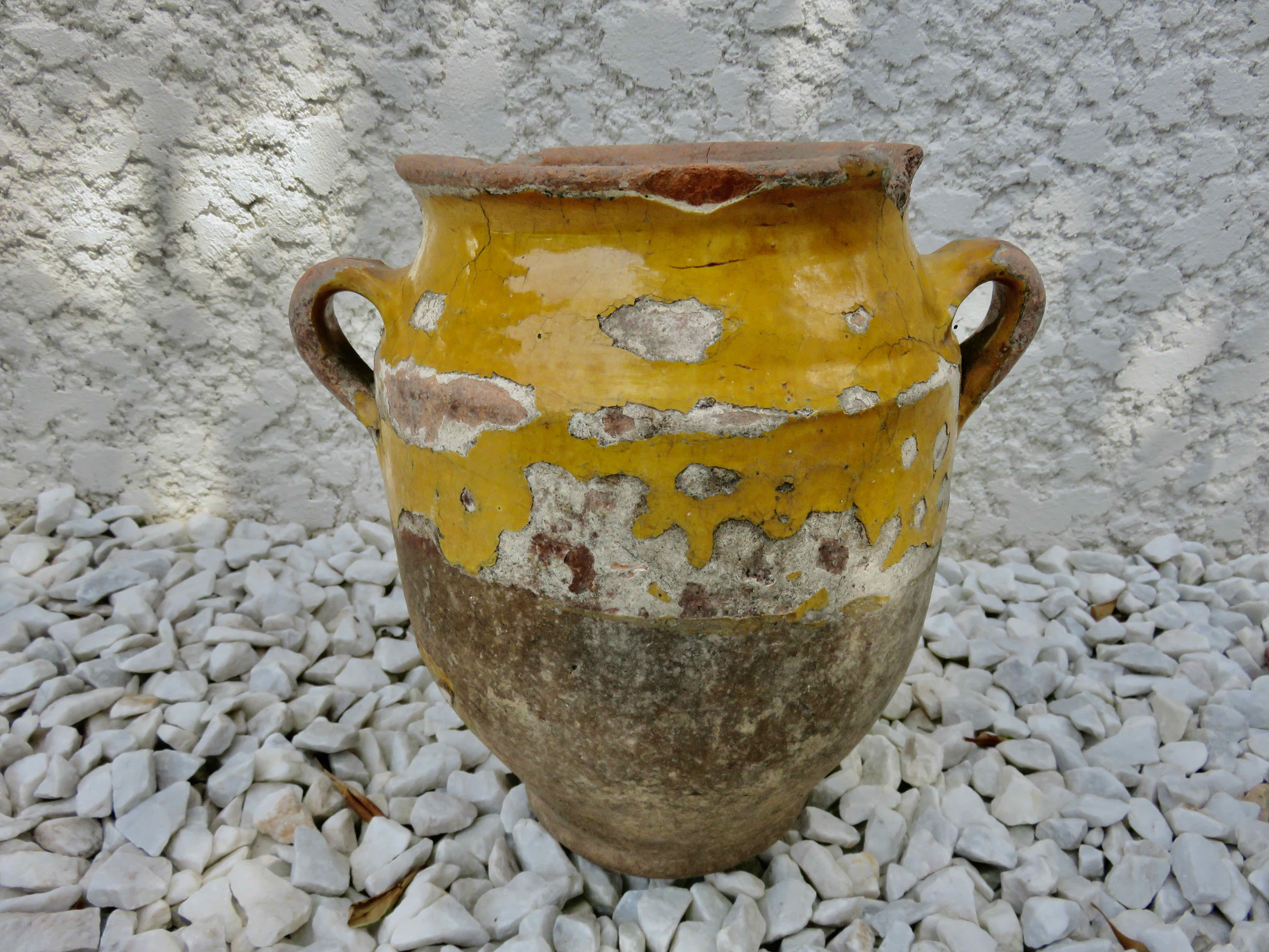 Old candied pot in yellow glazed terracotta XIX century