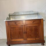 Antique wood and marble kitchen sideboard with carved backsplash