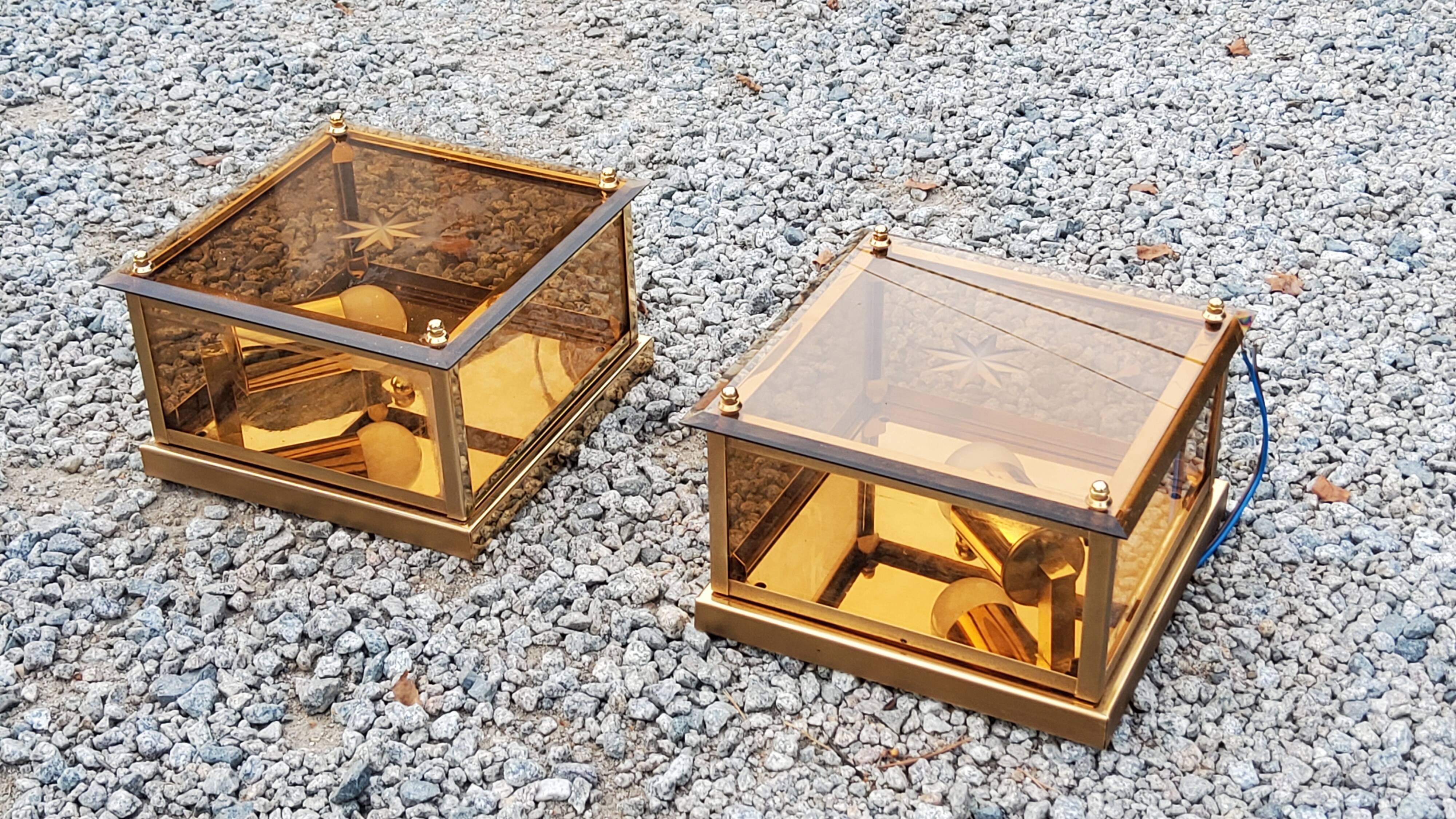 Pair of wall lamps in smoked glass and gilded metal from the 70s/80s
