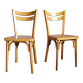 Old and pretty pair of Baumann bistro chairs