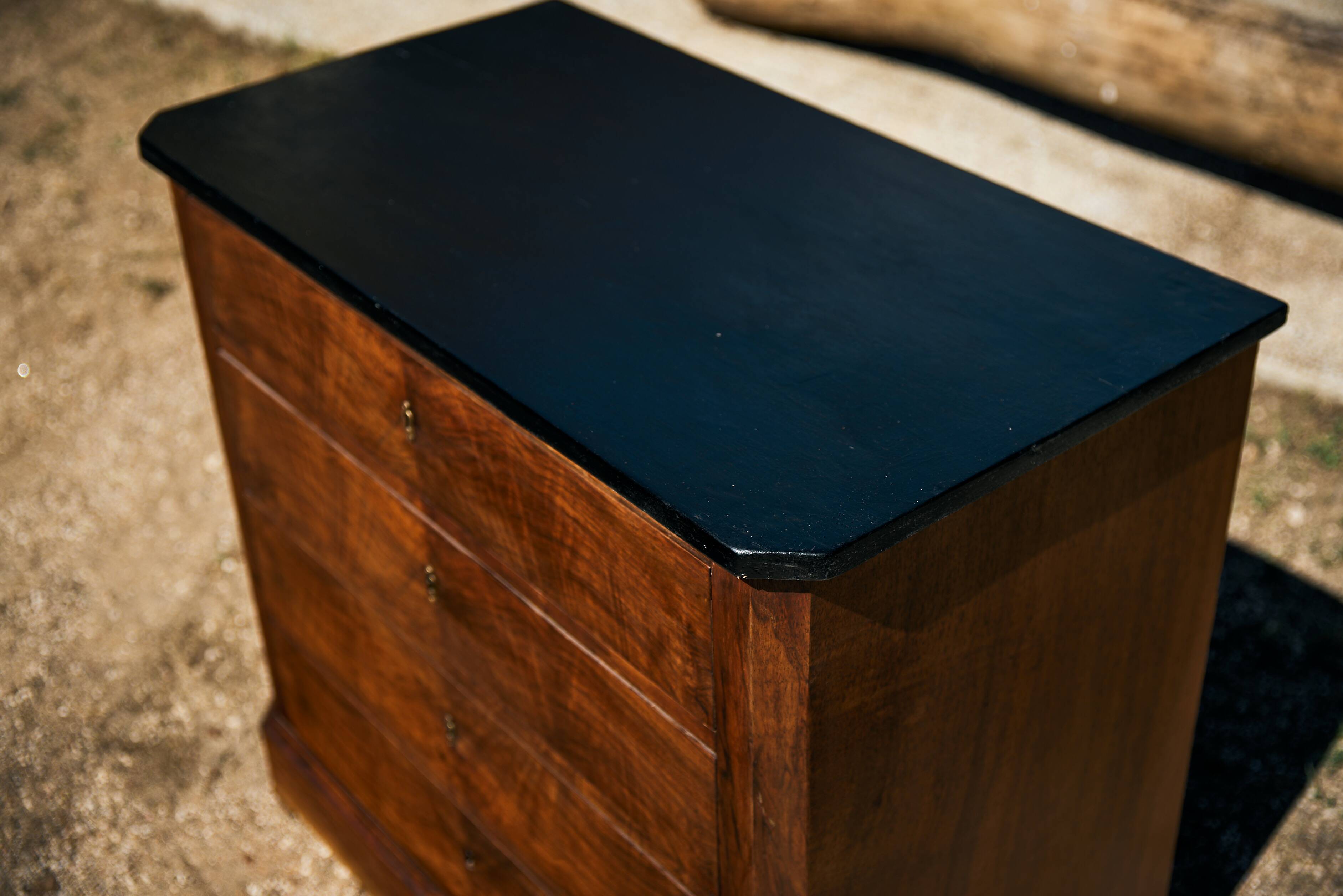 Small Louis-Philippe chest of drawers with four drawers, black top.