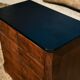 Small Louis-Philippe chest of drawers with four drawers, black top.