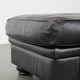 Large and timeless black ottoman made of cowhide leather in English style
