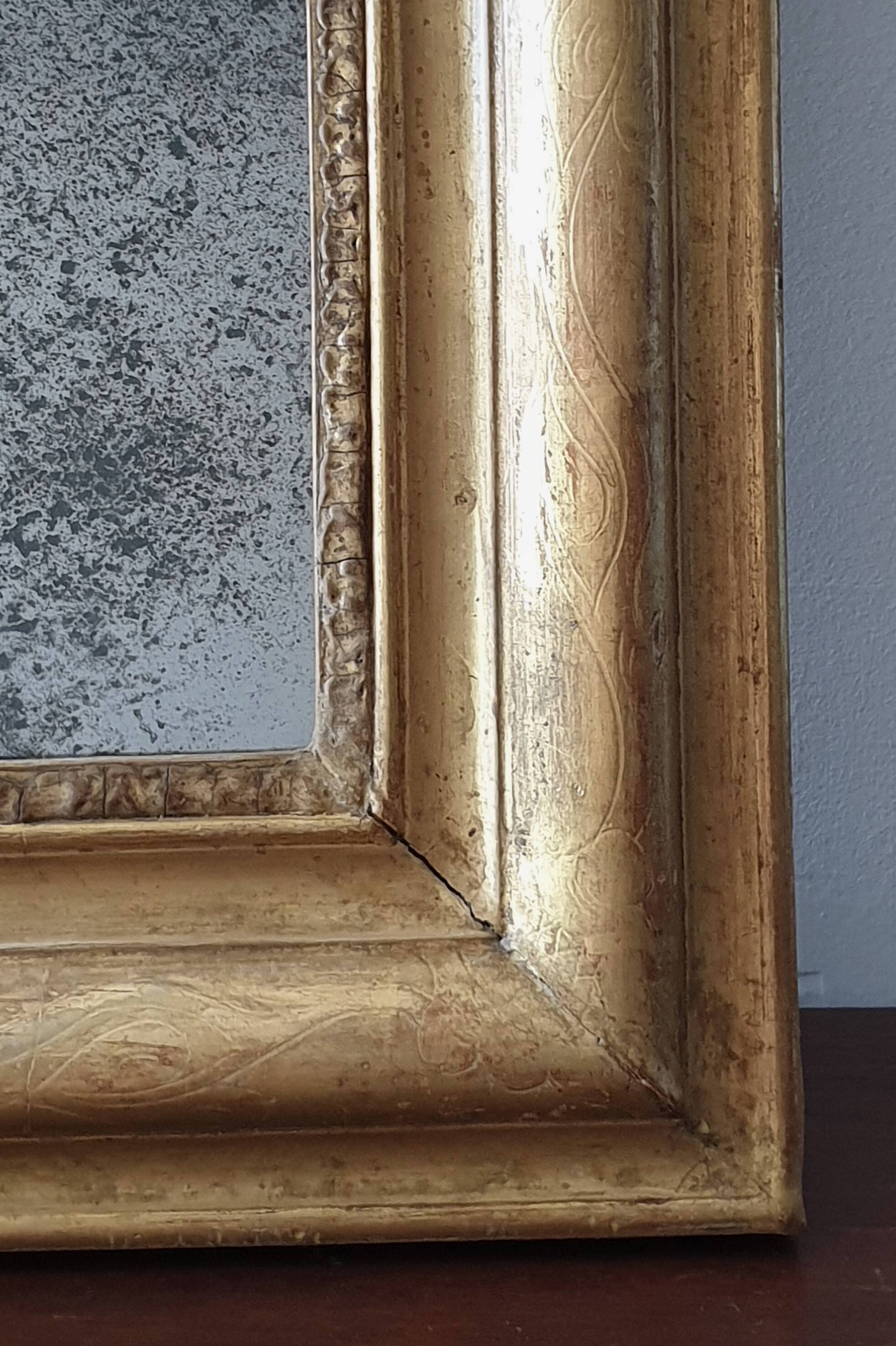Old gilded mirror and old mercury glass - wall mirror with gold leaf