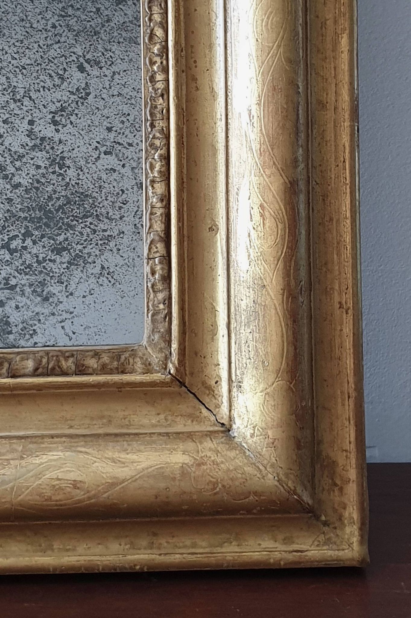 Old gilded mirror and old mercury glass - wall mirror with gold leaf