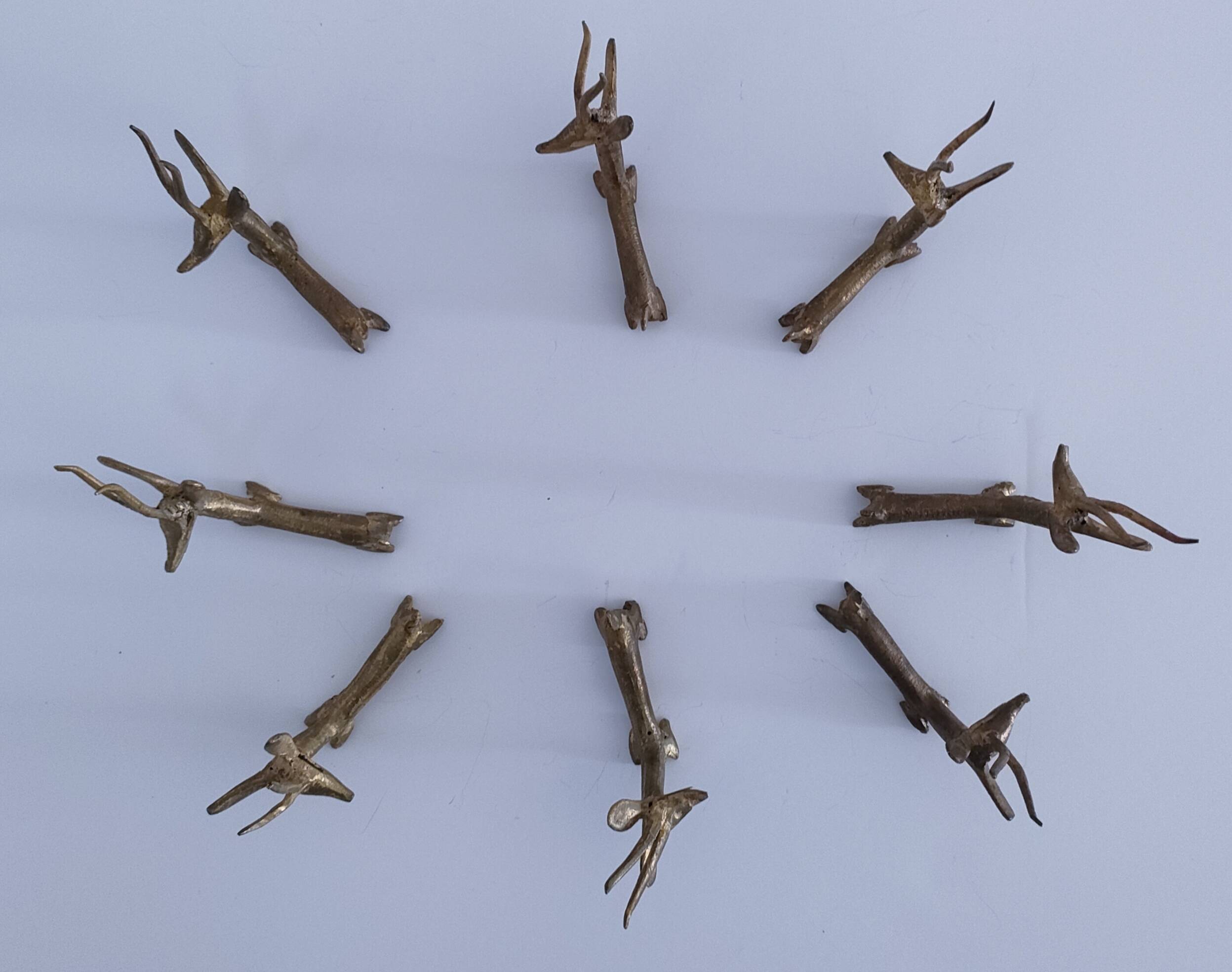 eight vintage brass Gazelle knife rests