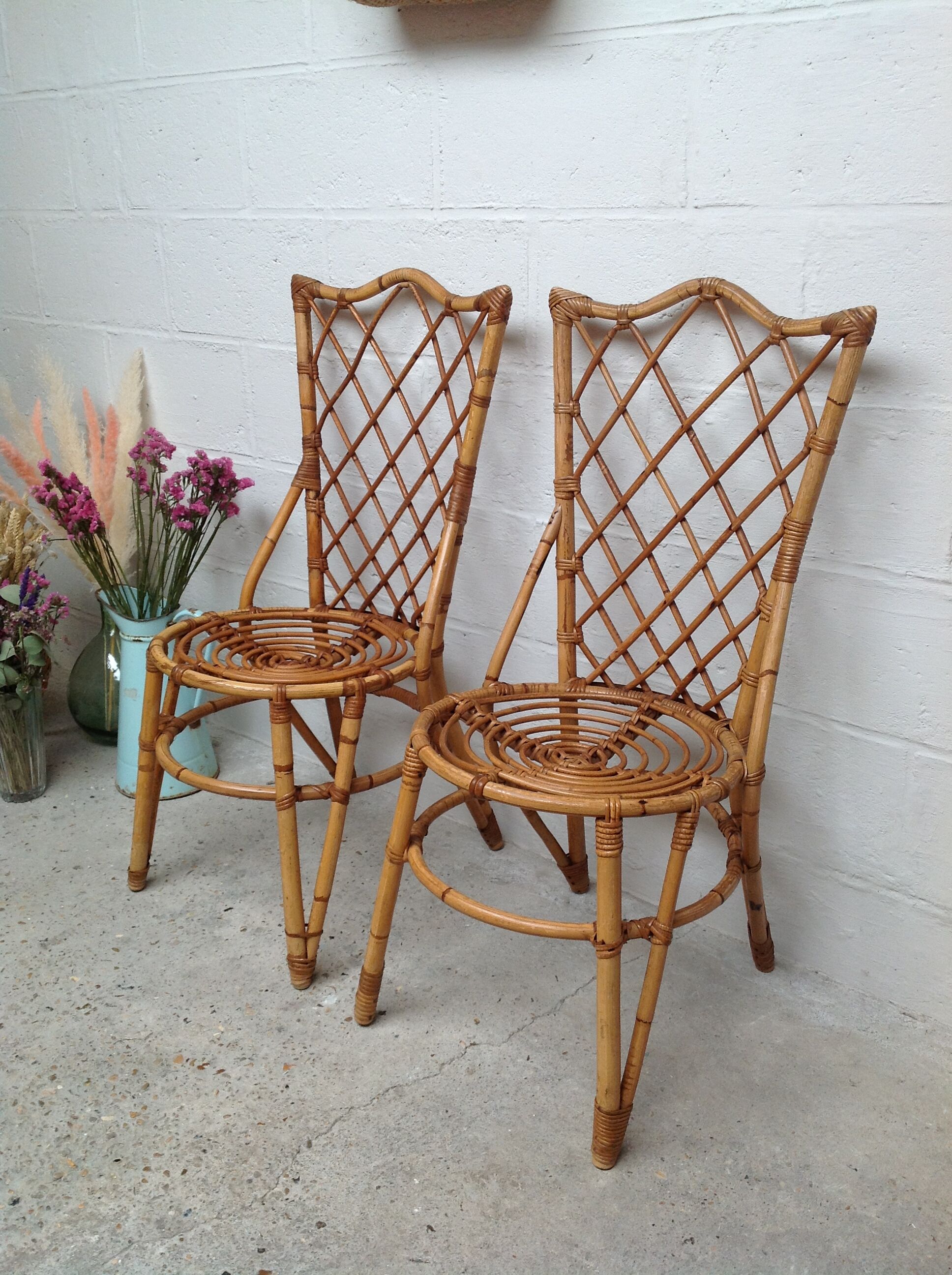 Pair of rattan chairs by Louis Sognot
