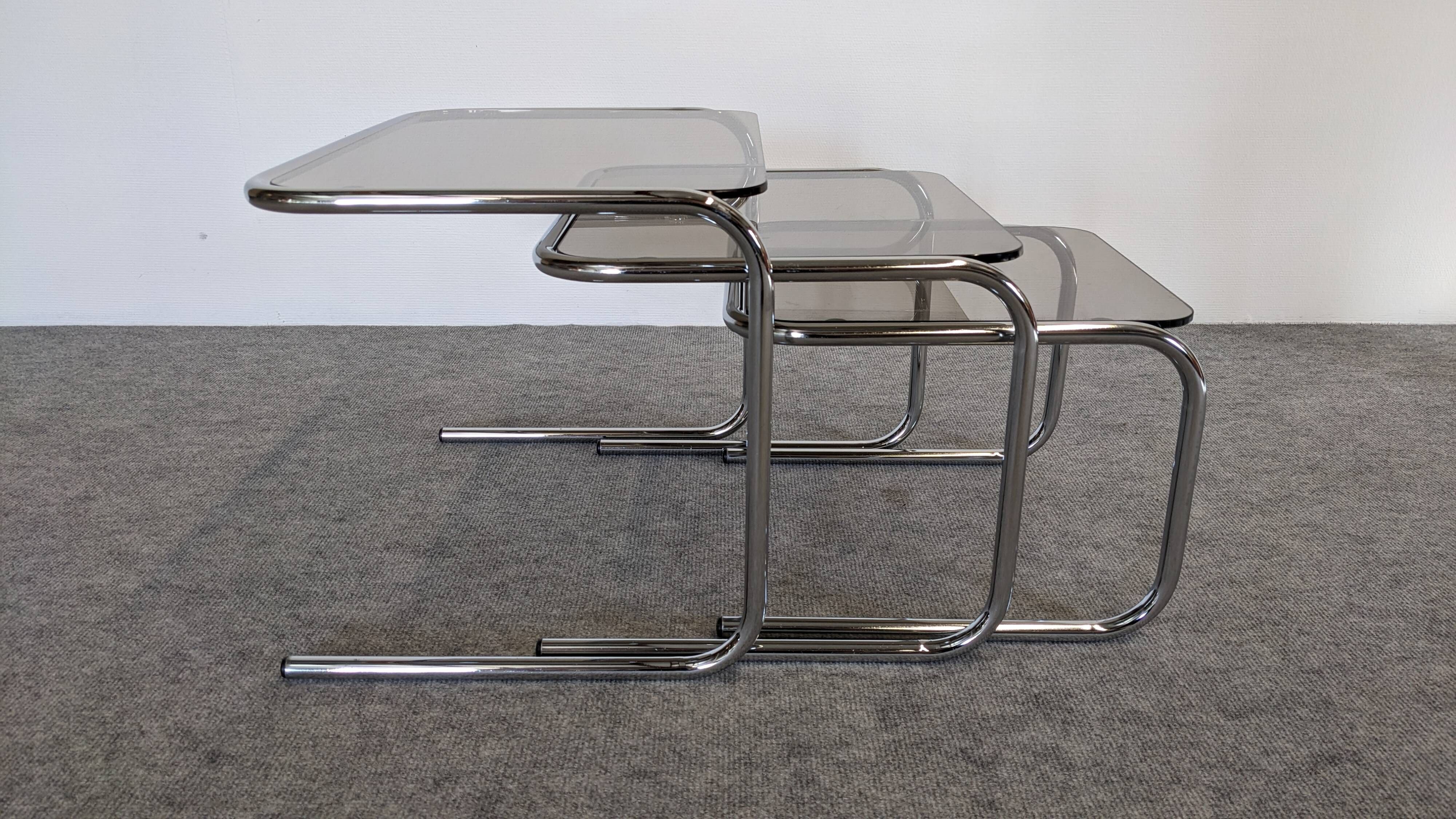 Nested tables with tubular chrome and smoked glass, France 1970.