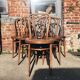Six patinated bistro chairs