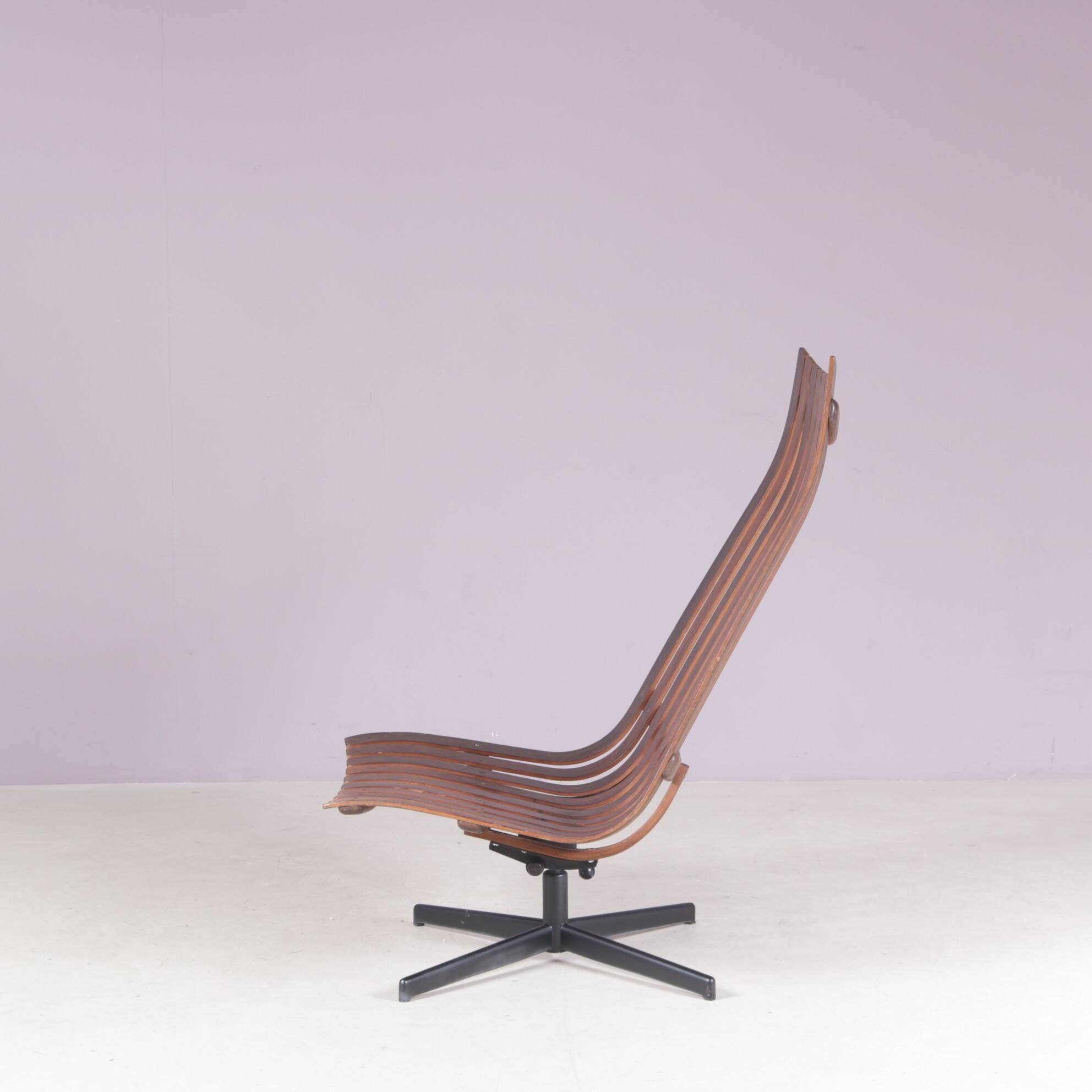 Lounge chair Rosewood with black metal cross base Hans Brattrud 1960s