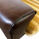 Vintage brown / ochre armchair / a chair on wheels