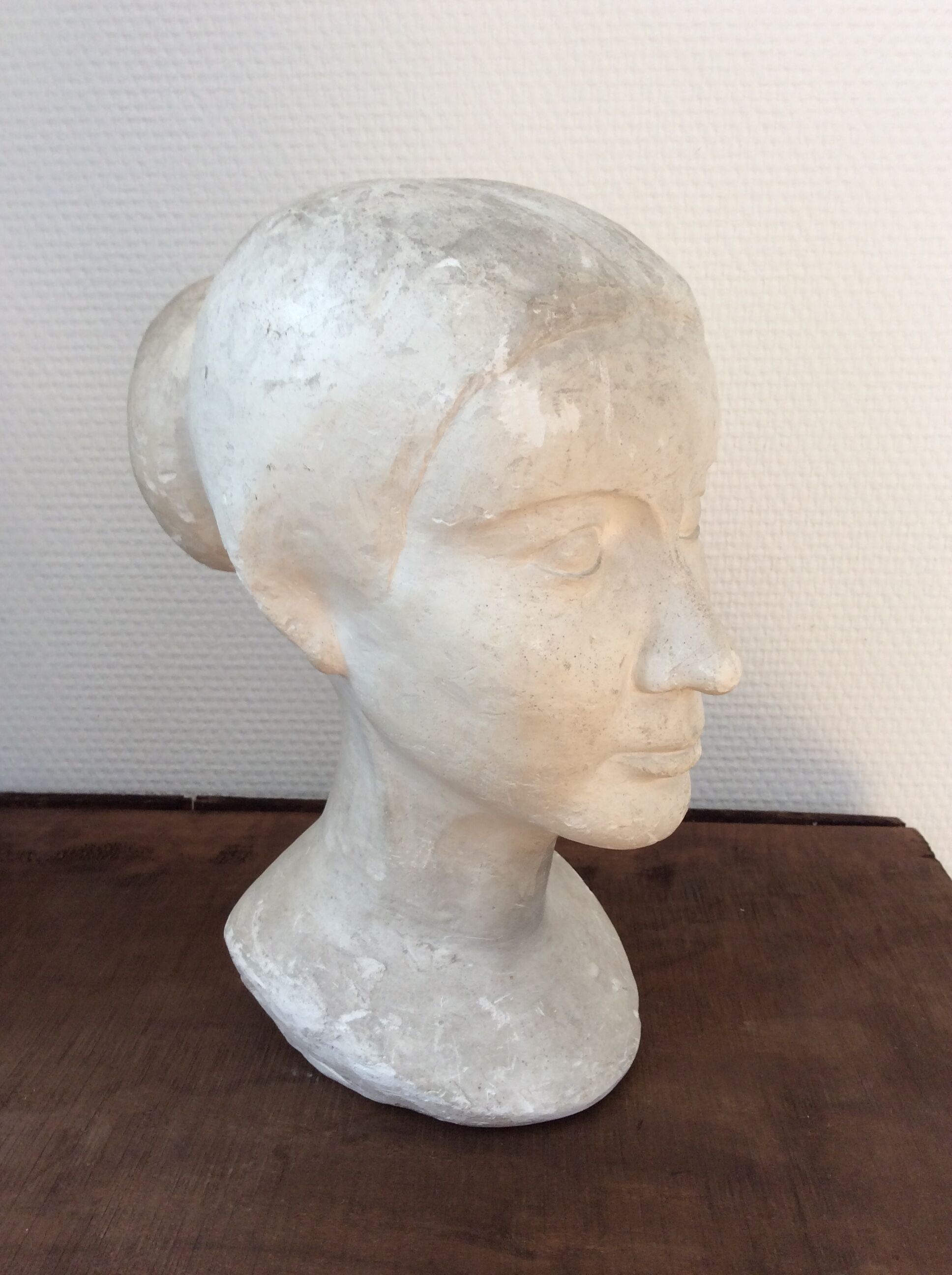 Plaster young woman at the bun