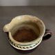 Antique pottery milk jug