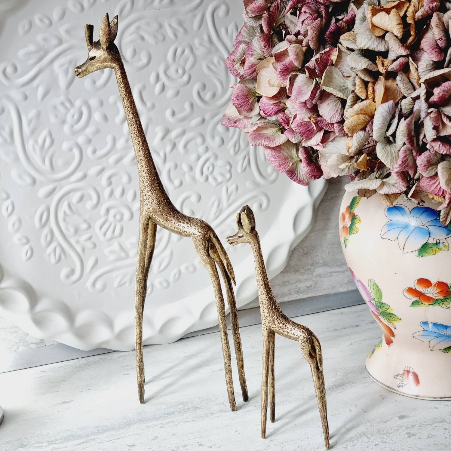 Stylized brass giraffes