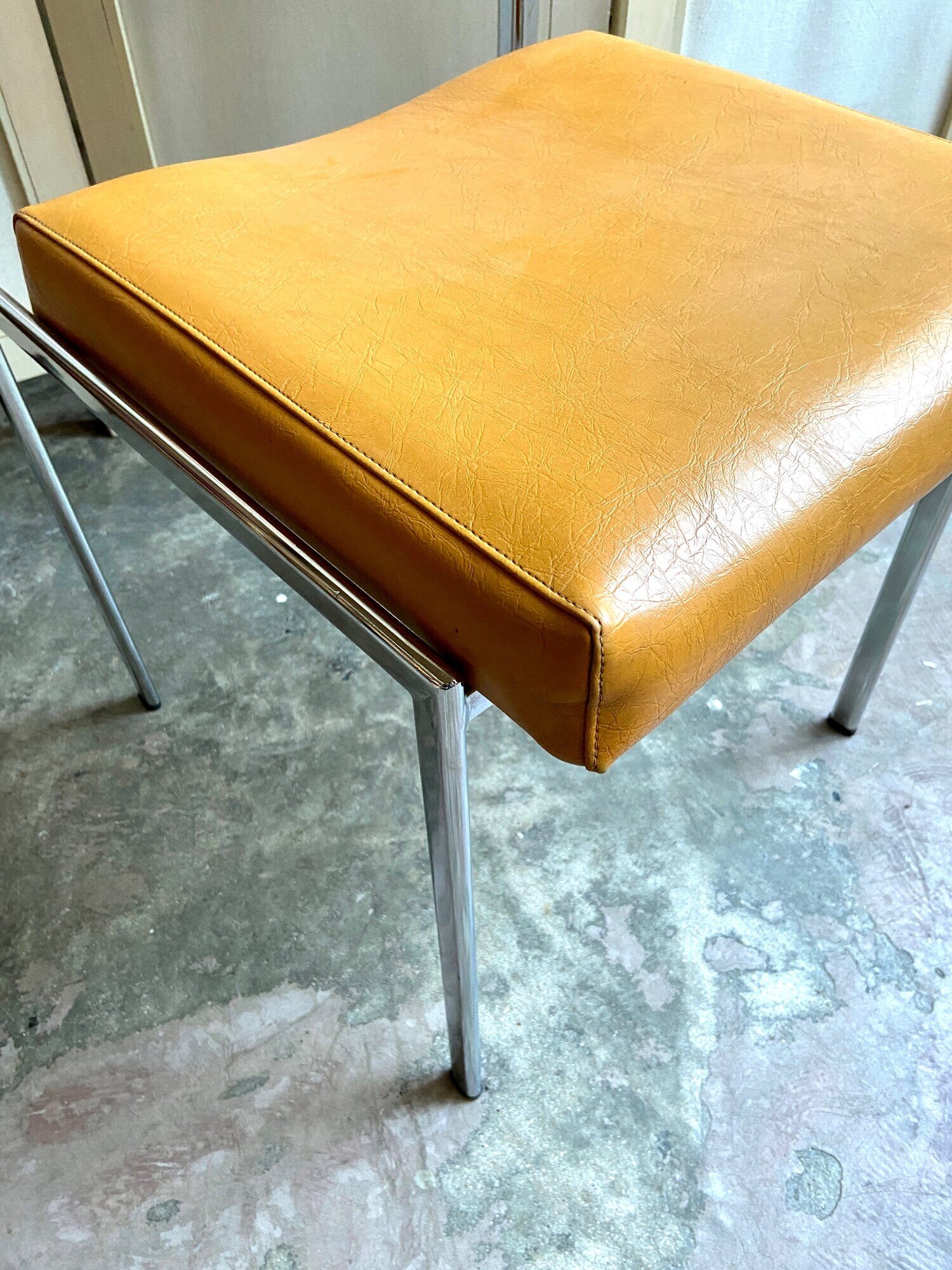 Chair in chromed metal and ochre skaï 1970s