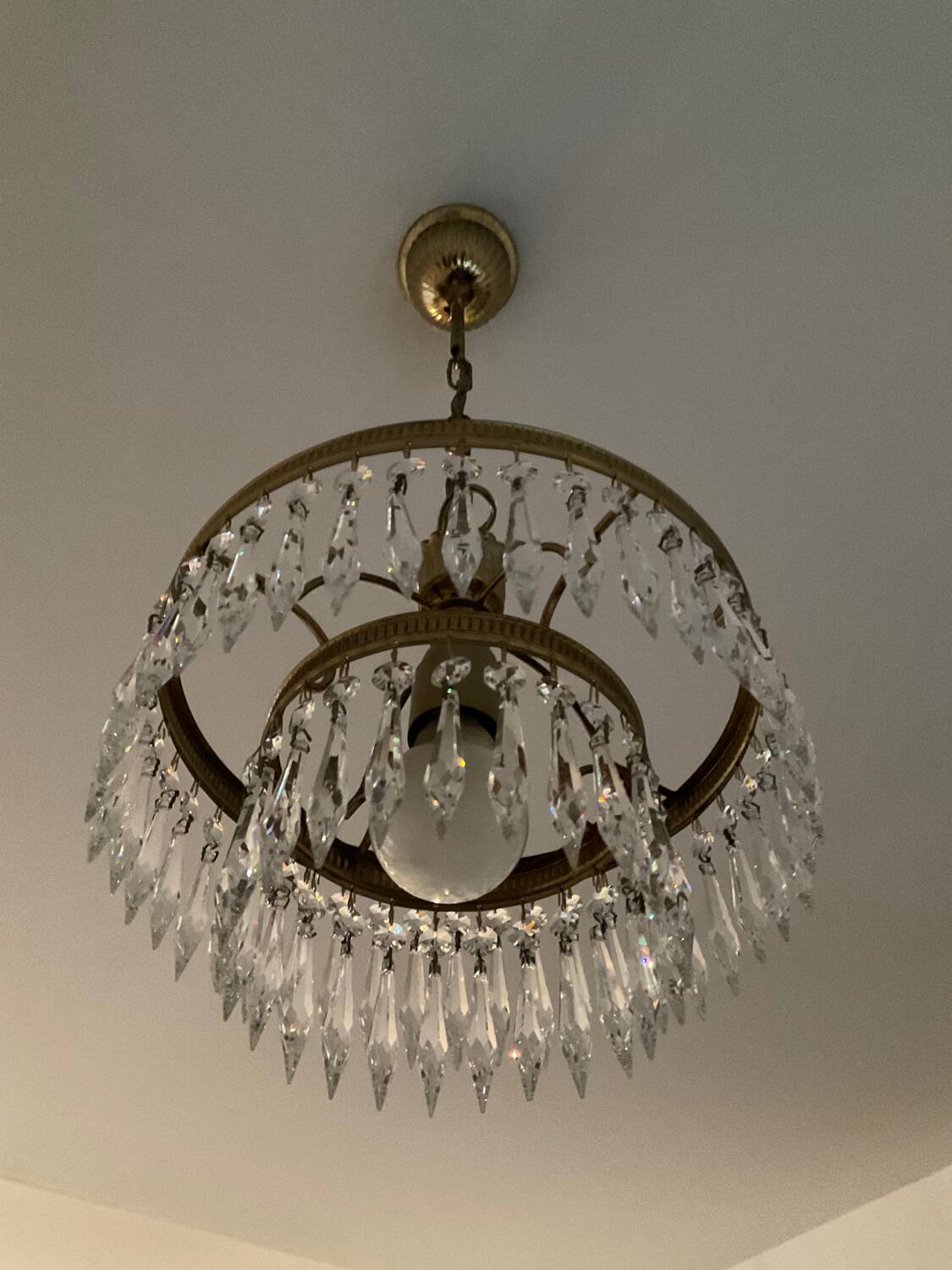Cascade chandelier with crystal and brass tassels