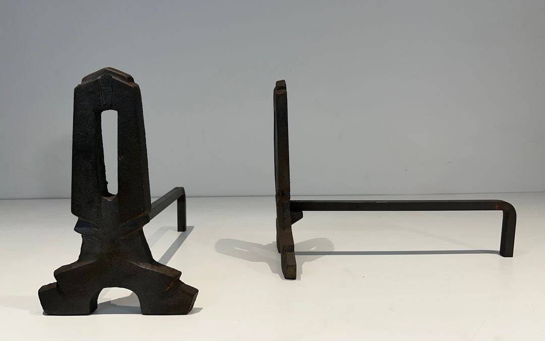 Pair of Modernist Andirons in Cast Iron with Openwork Uprights and Tripod Bases