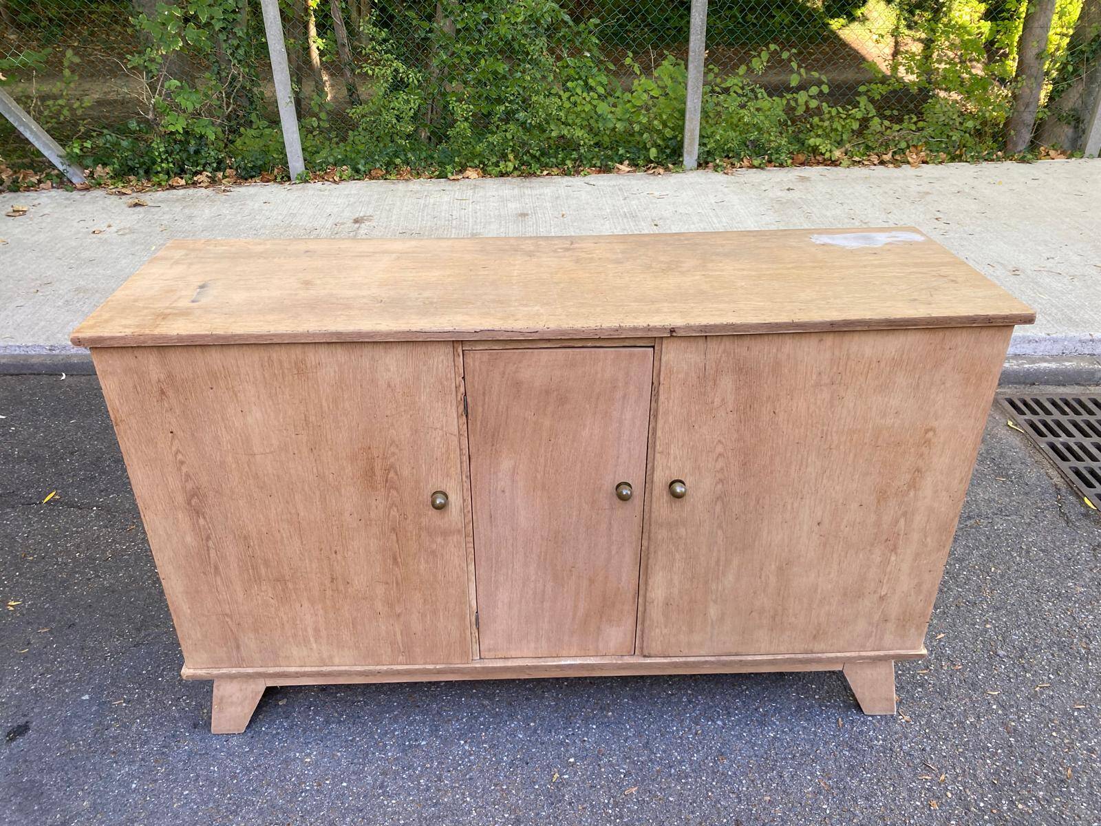 Vintage 1950s oak enfilade buffet with tapered legs.