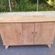 Vintage 1950s oak enfilade buffet with tapered legs.