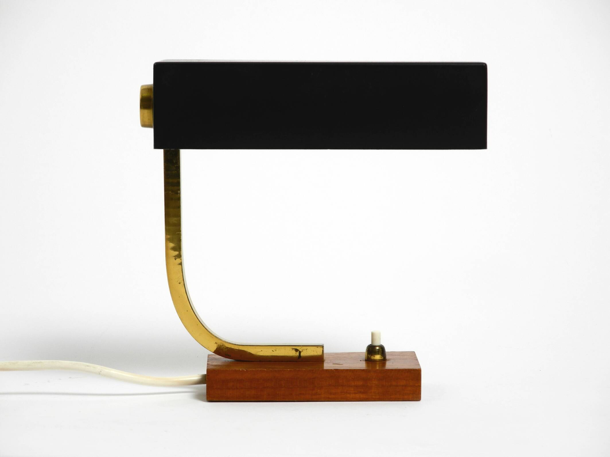 Beautiful small Mid Century Modern metal and brass table lamp with teak bas