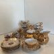 Gold Italian porcelain service. Coffee cups - sugar - cream pot / Gallant scene