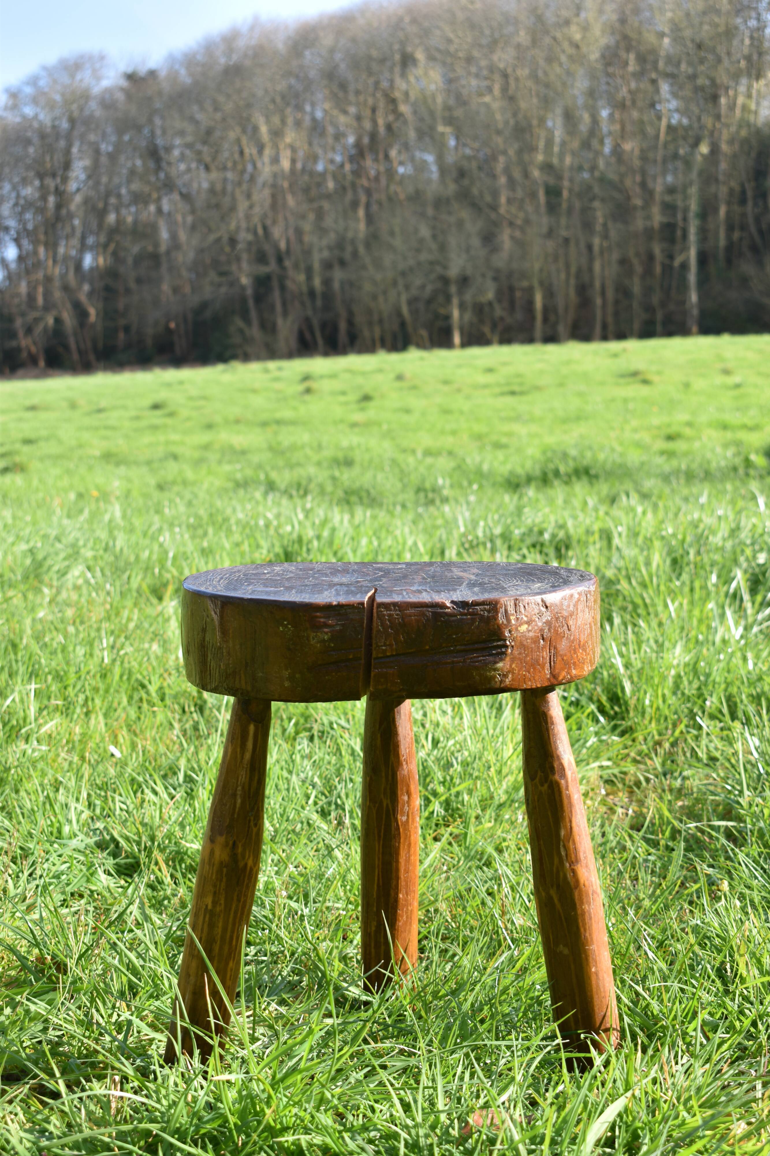 Ancient tripod brutalist stool