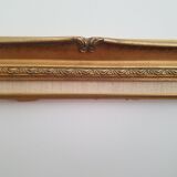 Old gilded frame in solid wood and plaster.