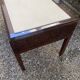 Art Deco desk in varnished mahogany.