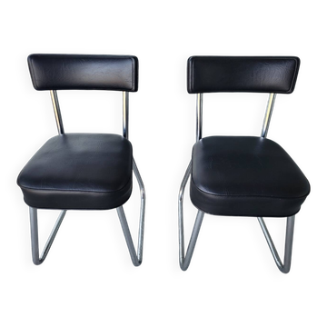 Pair of vintage black faux leather and chrome office chairs in very good condition.