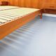 Double bed vintage Scandinavian in teak from the 1960s with integrated bedside tables.
